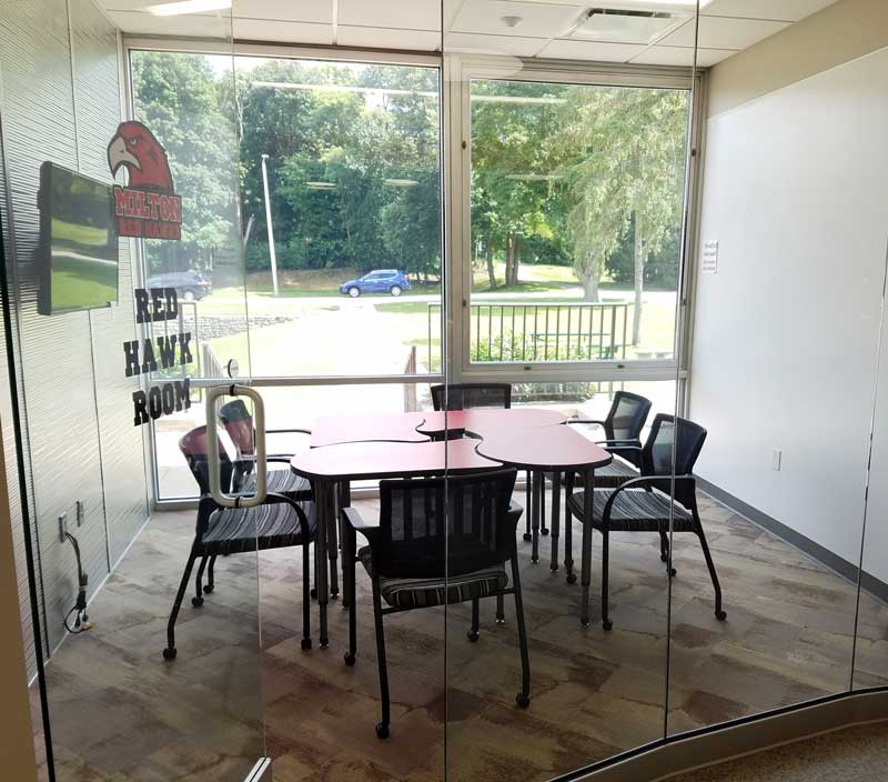Redhawk Room with Puzzle Table and roller chairs