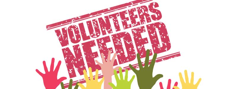 Volunteers Needed Text with shadow hands holding up text