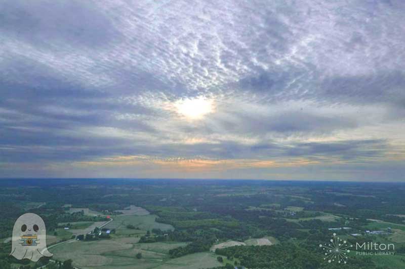 Look Out Above Landscape with Sun behind clouds