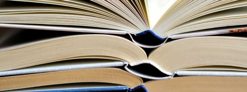 Stack of books laying open