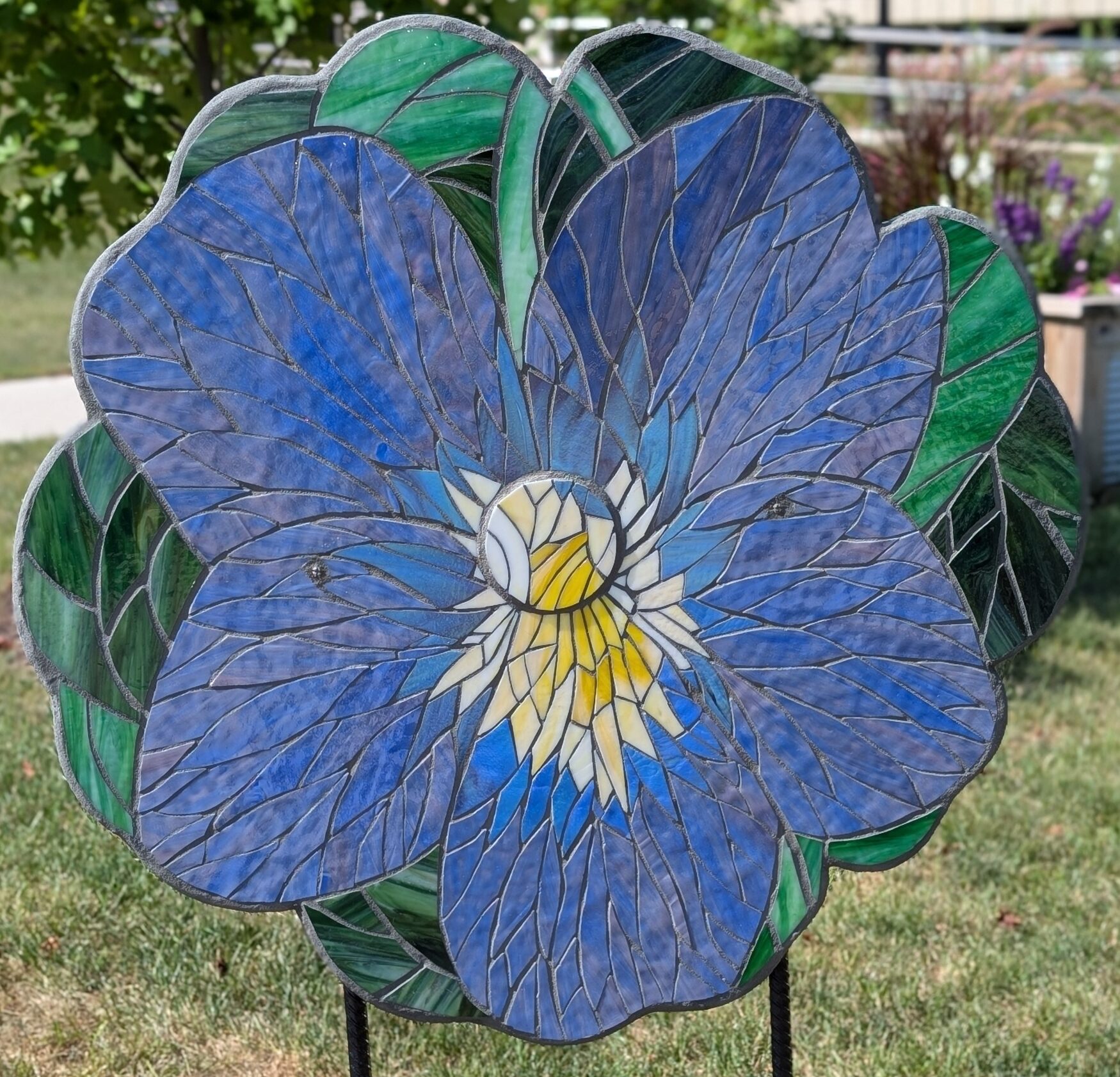Poppy cutout with a mosaic Wisconsin wood viotet design on it