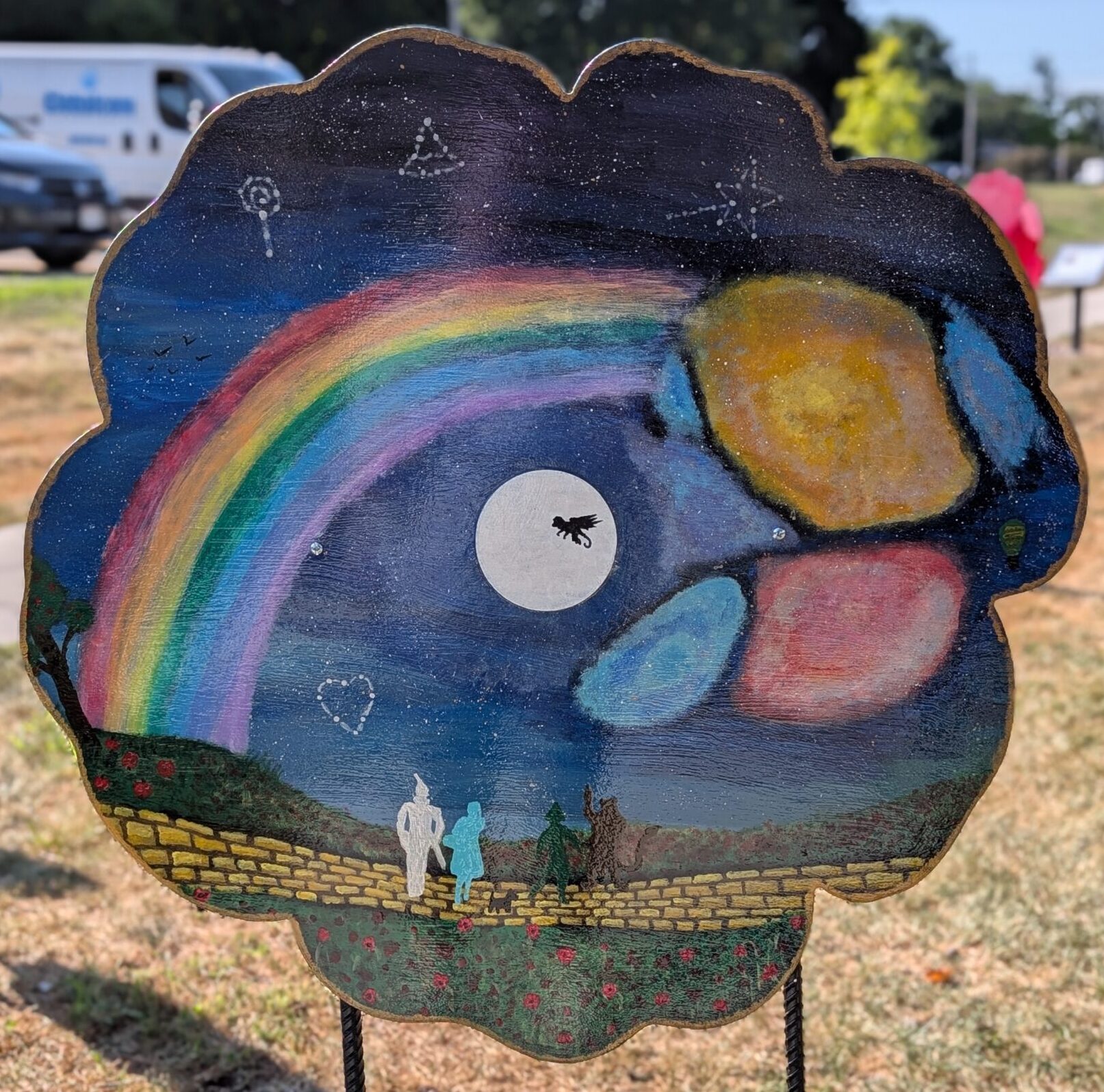 poppy cut-out painted with an imaginative scene of imagery from The Wizard of Oz