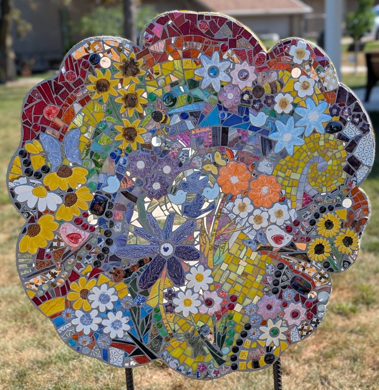 poppy cut-out decorated with a colorful mosaice to look like flowers